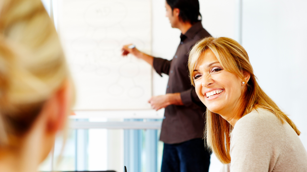 This is a photo of a woman who is confident and self-aware. She is smiling.